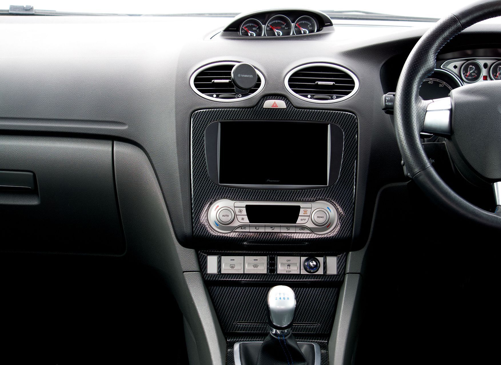 Explore the intricate design of a Ford car interior, featuring a sleek dashboard and steering wheel.